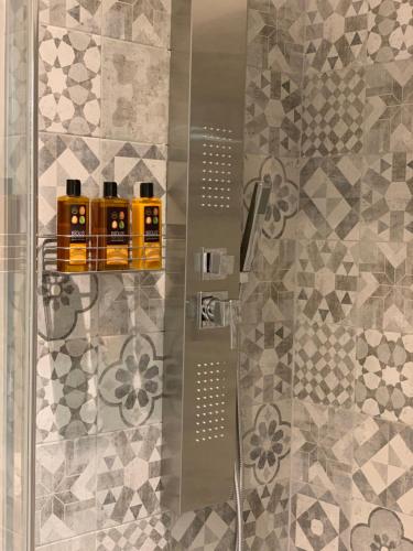 a bathroom with a shower with a glass door at Re Vittorio in Turin