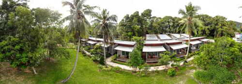 an aerial view of a resort with palm trees at Pana Long Beach Resort - SHA Plus in Ko Lanta