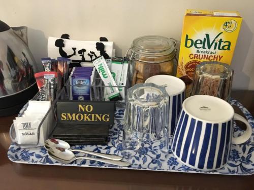 a tray with a no smoking sign and other items at The Annexe at Asbit Lodge in Mildenhall