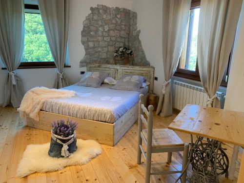 A bed or beds in a room at Al bosco incantato
