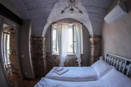Ένα ή περισσότερα κρεβάτια σε δωμάτιο στο CASA VIRGINIA
