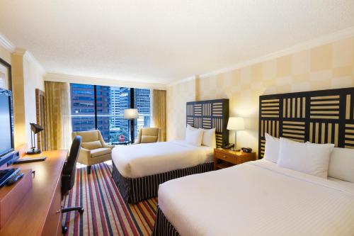 Un ou plusieurs lits dans un hébergement de l'établissement Pinnacle Hotel Harbourfront
