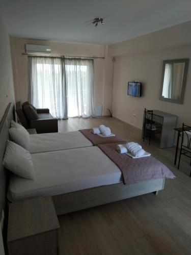 A bed or beds in a room at Lighthouse Apartments