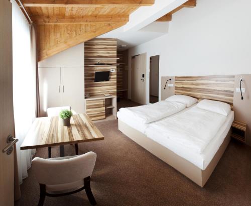 Postel nebo postele na pokoji v ubytování Hotel Monínec