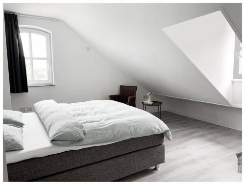 Ένα ή περισσότερα κρεβάτια σε δωμάτιο στο Huis in de natuur