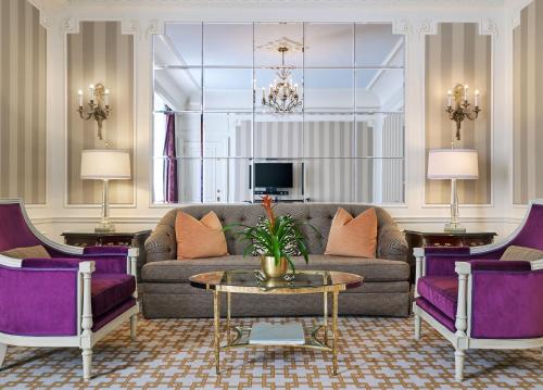 a living room with a couch and purple chairs at 5th & 55th Residence Club in New York