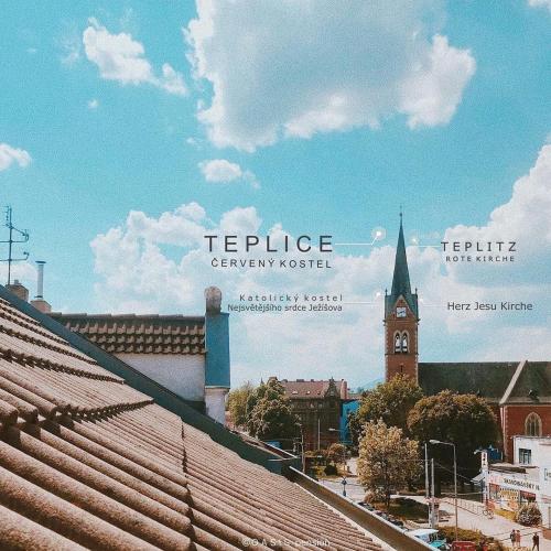 a view of a city with a clock tower at OASIS Teplice in Teplice