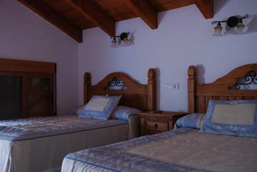Posteľ alebo postele v izbe v ubytovaní Casa Rural Las Encinas