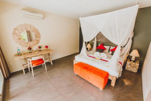 Postelja oz. postelje v sobi nastanitve Maylie Bali Villa
