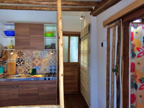 a kitchen with a sink and a counter at Mancora Apartments in Máncora