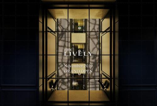 a glass window of a building with the words livela on it at THE LIVELY TOKYO AZABUJUBAN in Tokyo