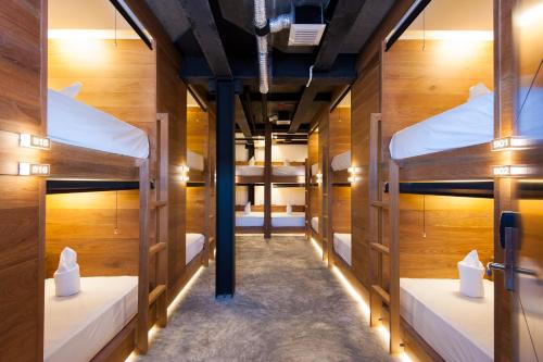 a room filled with lots of bunk beds at Indie Hostel - Koh Tao in Koh Tao