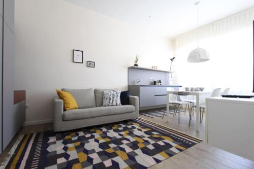 a living room with a couch and a table at LA CASABELLA in Terralba