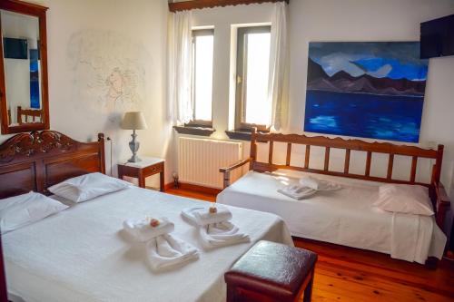 Postel nebo postele na pokoji v ubytování Hotel Adam