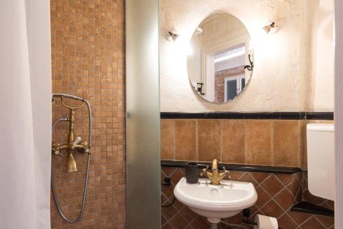 a bathroom with a sink and a mirror at Holiday Home Bozanić in Vrbnik