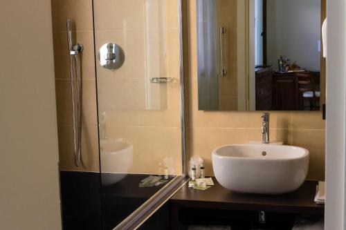 a bathroom with a sink and a shower at Hotel Sant'Antonin in Venice