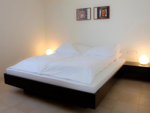 Łóżko lub łóżka w pokoju w obiekcie Puenta Aparthotel