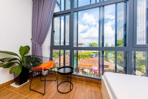 Postel nebo postele na pokoji v ubytování QA Hotel Dalat - City Centre