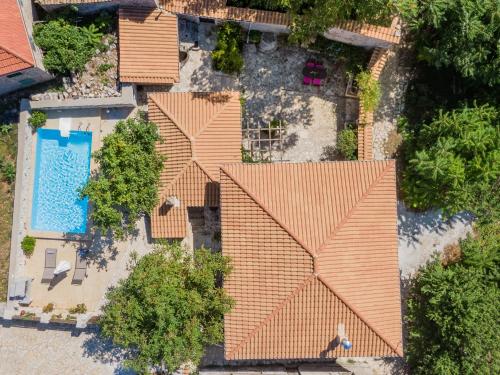 an overhead view of a house with a swimming pool at Villa Callisto- Elegant Restored Villa with Pool in Yírion
