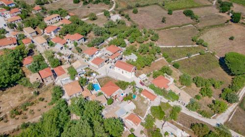an aerial view of a house with red roofs at Villa Callisto- Elegant Restored Villa with Pool in Yírion