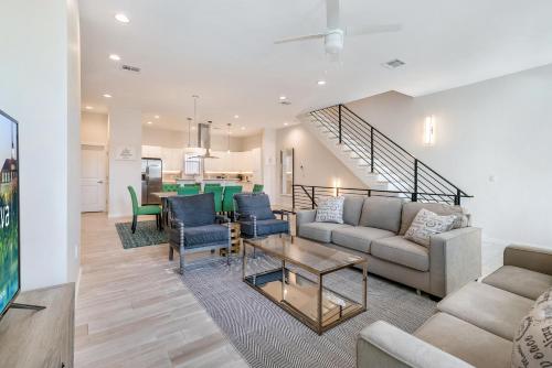 a living room with a couch and a table at Private Townhouse in a Secure Location in New Orleans