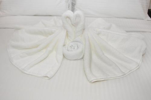 Postel nebo postele na pokoji v ubytování De Luna Hotel Sri Petaling