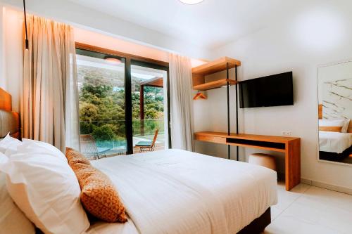 Кровать или кровати в номере Elite Luxury Villas