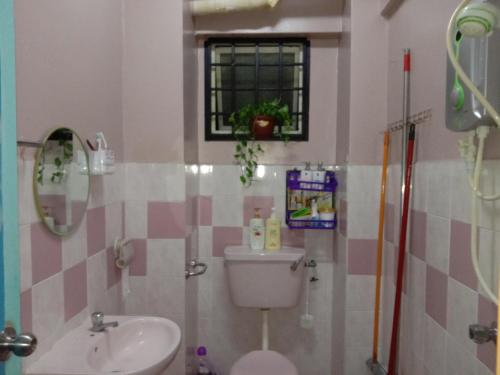 a bathroom with a toilet and a sink at A room in Aparnt Sri Impian in Johor Bahru