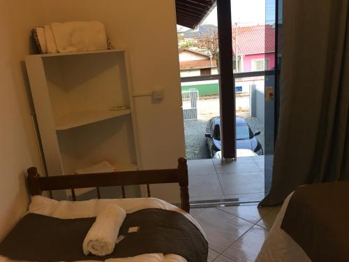 Giường trong phòng chung tại Hospedagem Penha - Beto carreiro e Praias