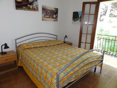 Ένα ή περισσότερα κρεβάτια σε δωμάτιο στο Villa Amalfi