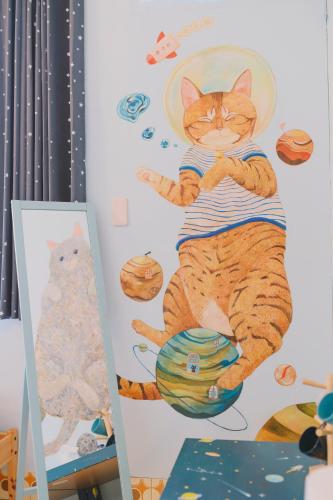 a painting of a cat on a wall at Red Letter Day in Tainan