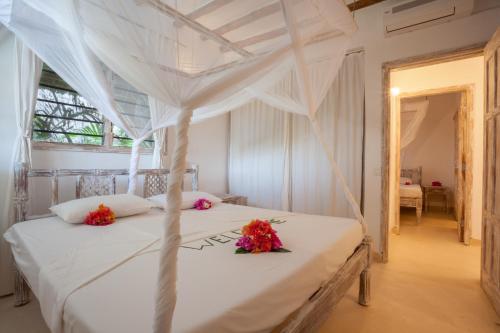 Ένα ή περισσότερα κρεβάτια σε δωμάτιο στο Swordfish Villas