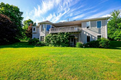 a house with a large lawn in front of it at Lily's garden in Charlottetown
