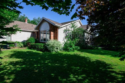 a house with a large lawn in front of it at Lily's garden in Charlottetown