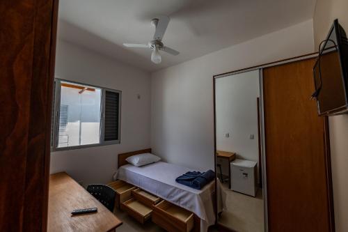 Cama ou camas em um quarto em Hospedaria Santo Antônio
