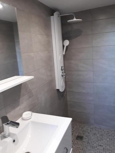 a bathroom with a white sink and a mirror at Coitoux Joëlle Mas de CAYRE Mas de Guinet 46150 Gigouzac in Gigouzac