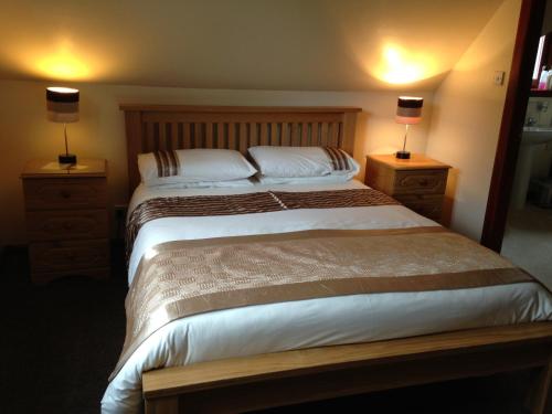 Ένα ή περισσότερα κρεβάτια σε δωμάτιο στο Thistle Cottage