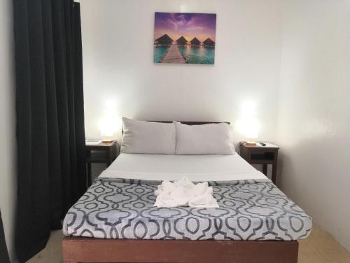 Postel nebo postele na pokoji v ubytování Softstone resort