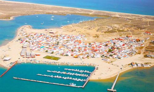 an aerial view of a marina with boats in the water at Varandas da Barreta in Olhão