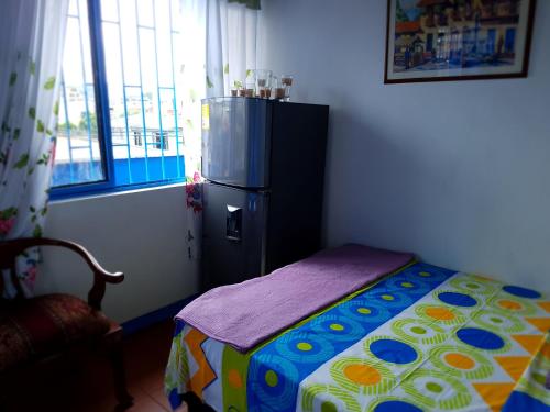 En eller flere senger på et rom på Apartamento en Pereira Amoblado y con Terraza