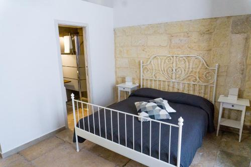Ένα ή περισσότερα κρεβάτια σε δωμάτιο στο Donato Rooms