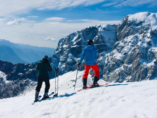 two people standing on top of a snow covered mountain at Tom's Alpenhütte in Jenig