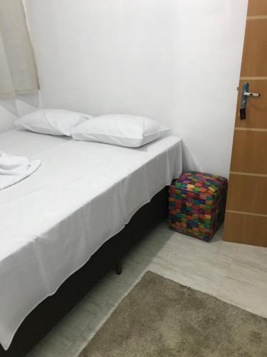 Ένα ή περισσότερα κρεβάτια σε δωμάτιο στο Pousada Anjos da Montanha