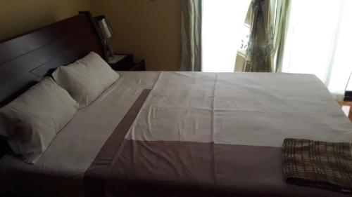 Postel nebo postele na pokoji v ubytování Afilux Residencial