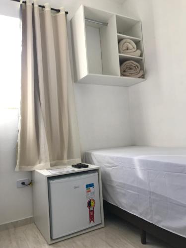 Ένα ή περισσότερα κρεβάτια σε δωμάτιο στο Pousada Anjos da Montanha
