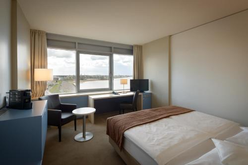 ATLANTIC Hotel Sail Cityにあるベッド