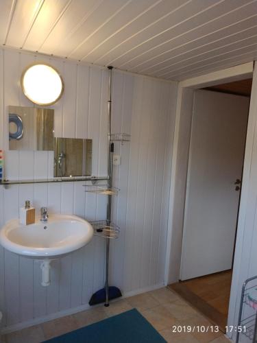 a bathroom with a sink and a mirror at Pension Panorama in Tanvald
