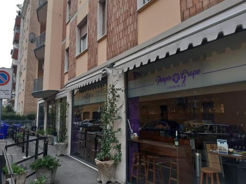 a store front of a building with a sign on it at Appartamento Soleluna in Parma