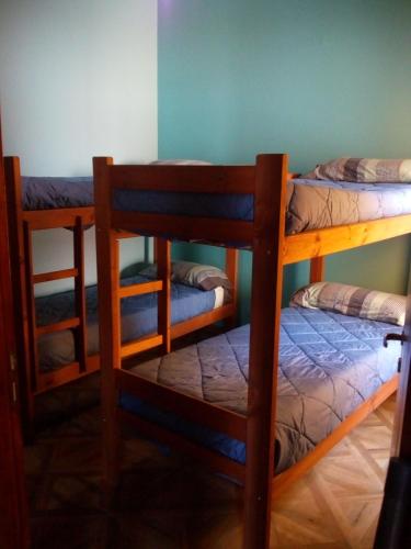 a room with three bunk beds in a room at CASA BALCARCE in Balcarce