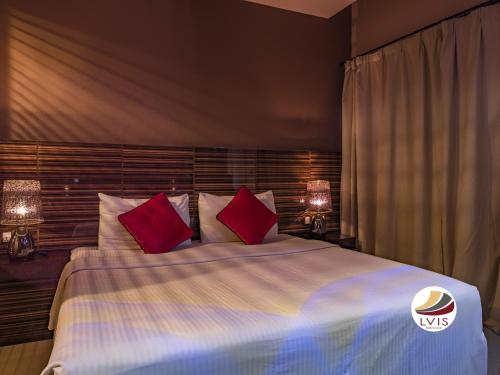 Postel nebo postele na pokoji v ubytování LVIS blancura Hotel
